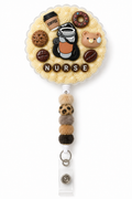 Coffee Shift NURSE decoden cream badge reel with coffee, donut, cookie, bear and five fuzzy beads on a pure white background