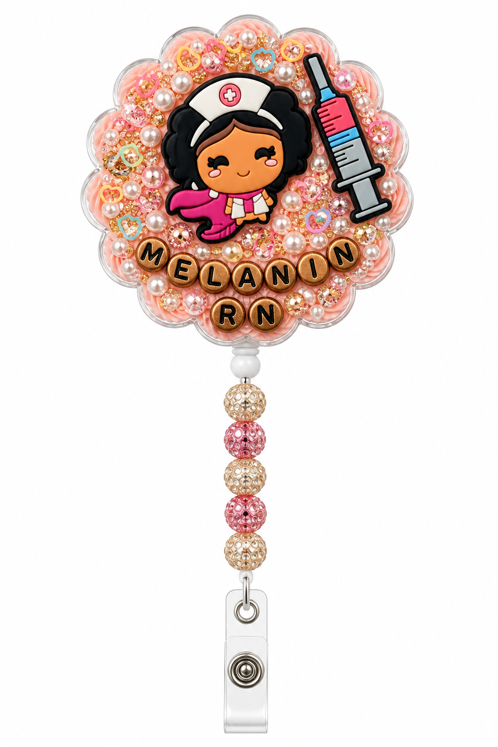 MELANIN RN decoden cream badge reel with Black superhero nurse, syringe, pearl heart sprinkles and five pink and rose-gold rhinestone beads