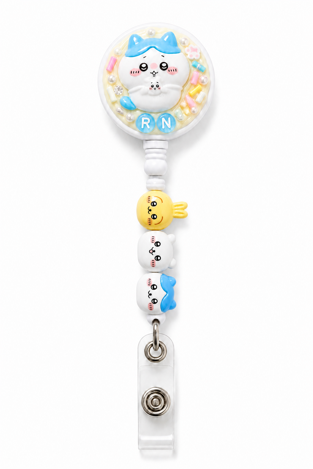 Mini Blue Cat RN decoden cream badge reel with three character beads on a pure white background
