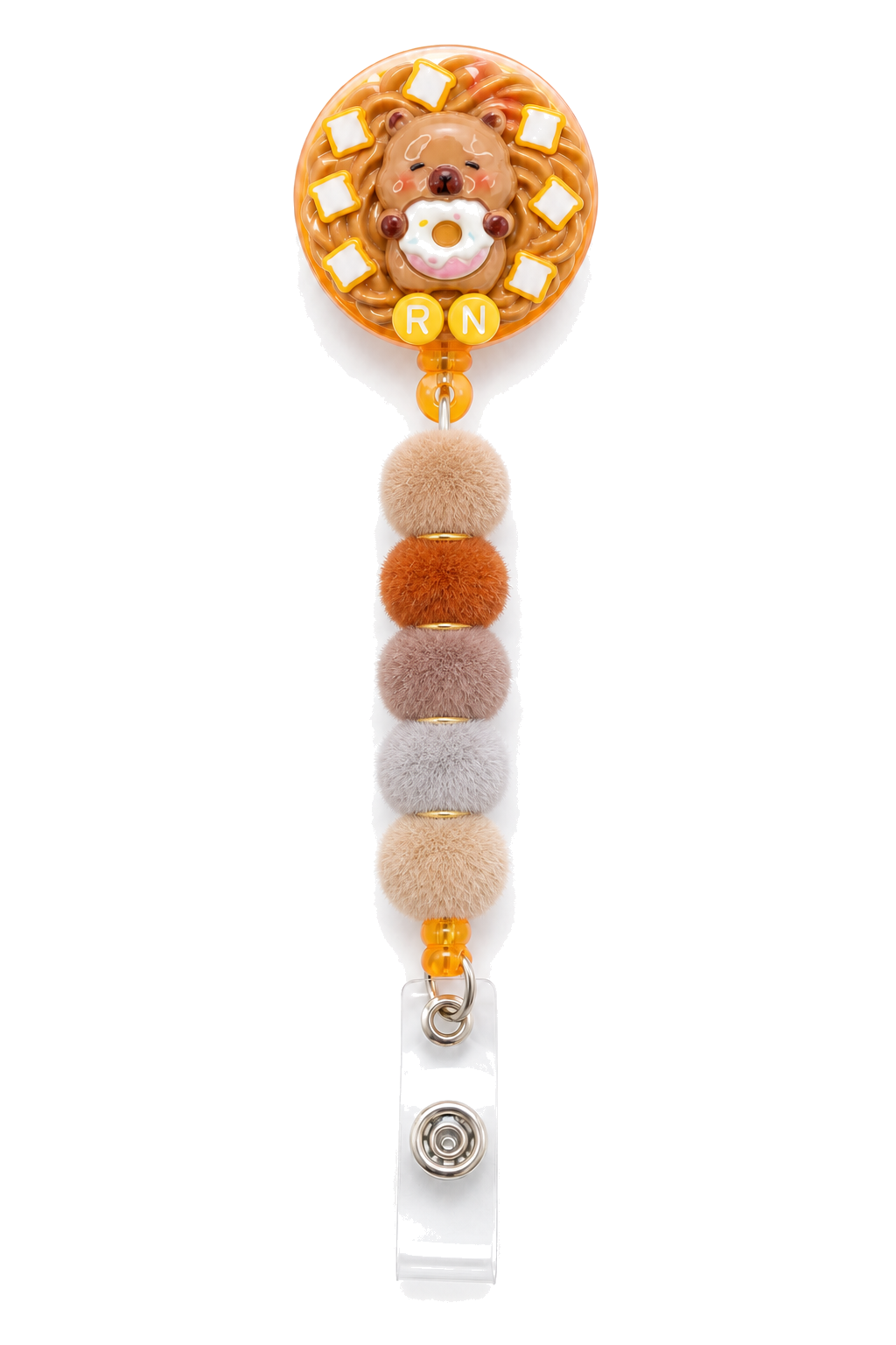Mini CAPY CAFE RN capybara donut decoden badge reel with five neutral pom-pom beads on a pure white background