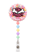 OH SNAP ORTHO RN decoden cream badge reel with broken bone charm, colorful bones, flowers and pastel square beads on a pure white background