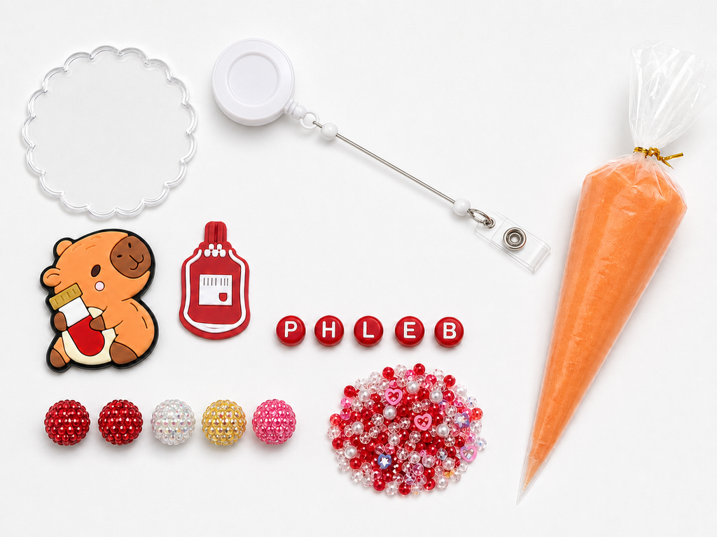 PHLEB phlebotomy DIY badge reel kit with capybara and sample-tube charm, blood bag charm, letters, five rhinestone beads, filler and orange cream glue