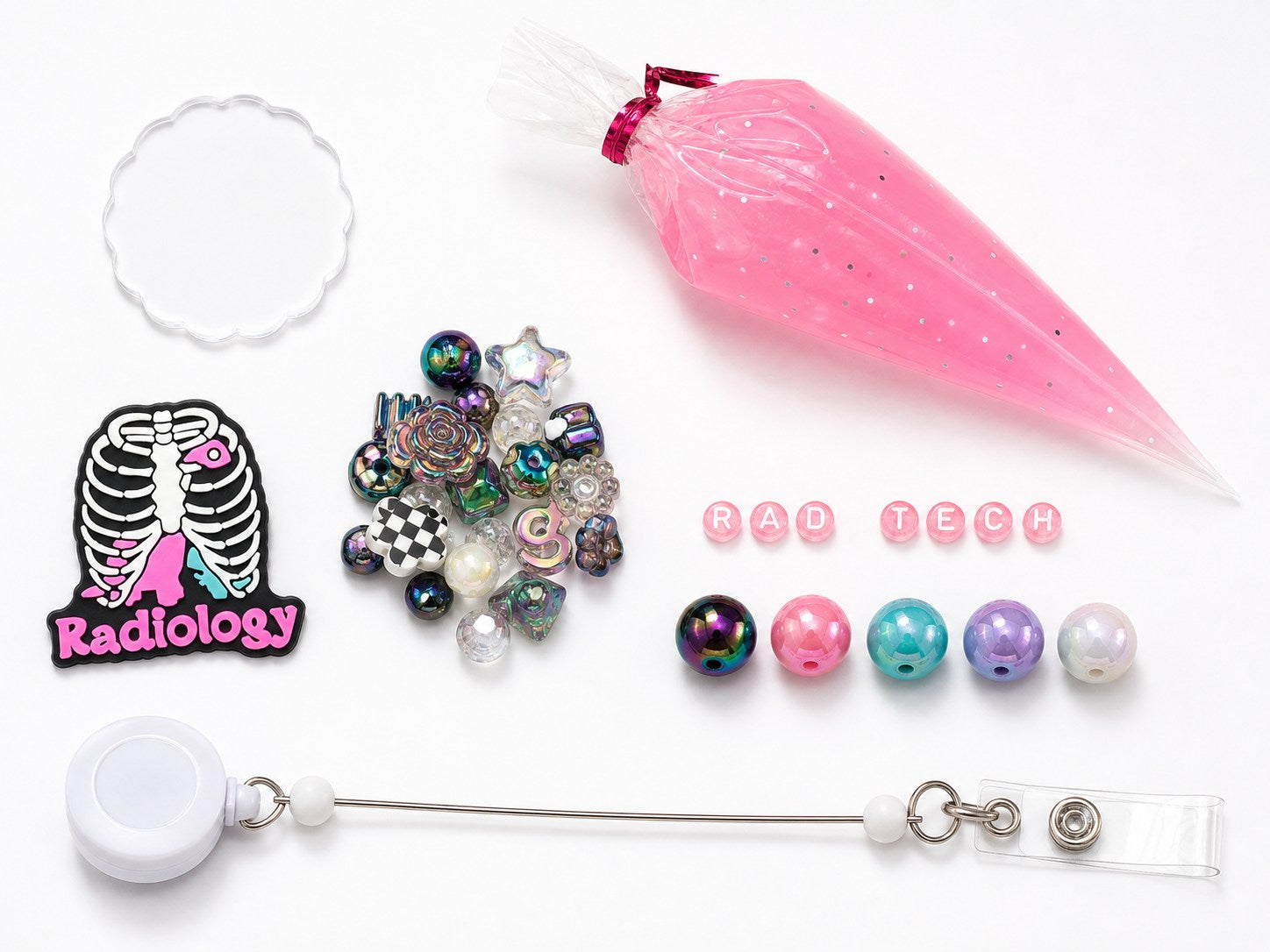 Radiology RAD TECH DIY badge reel kit contents with skeleton charm, letters, beads, mixed embellishments, reel, and pink cream glue