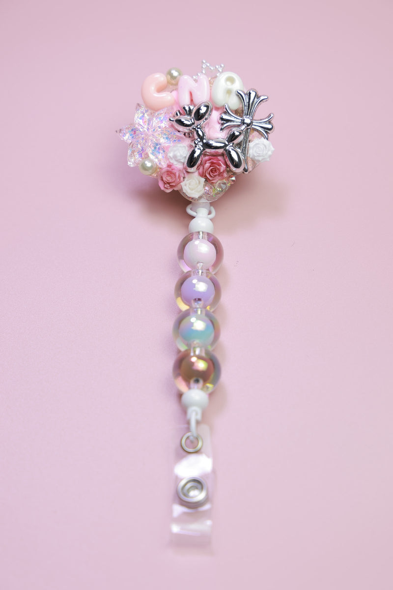 Pink floral badge reel with silver charms and pearls