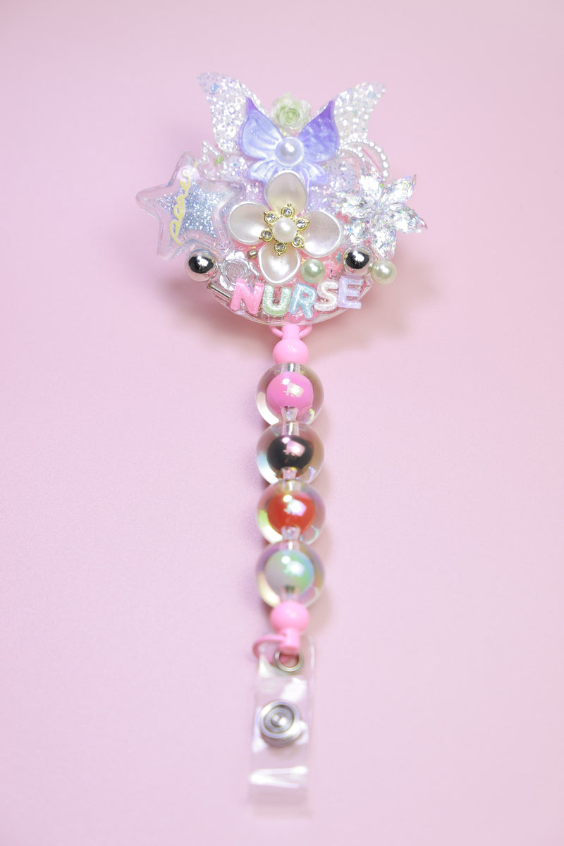 Crystal nurse badge reel with a pearl strand
