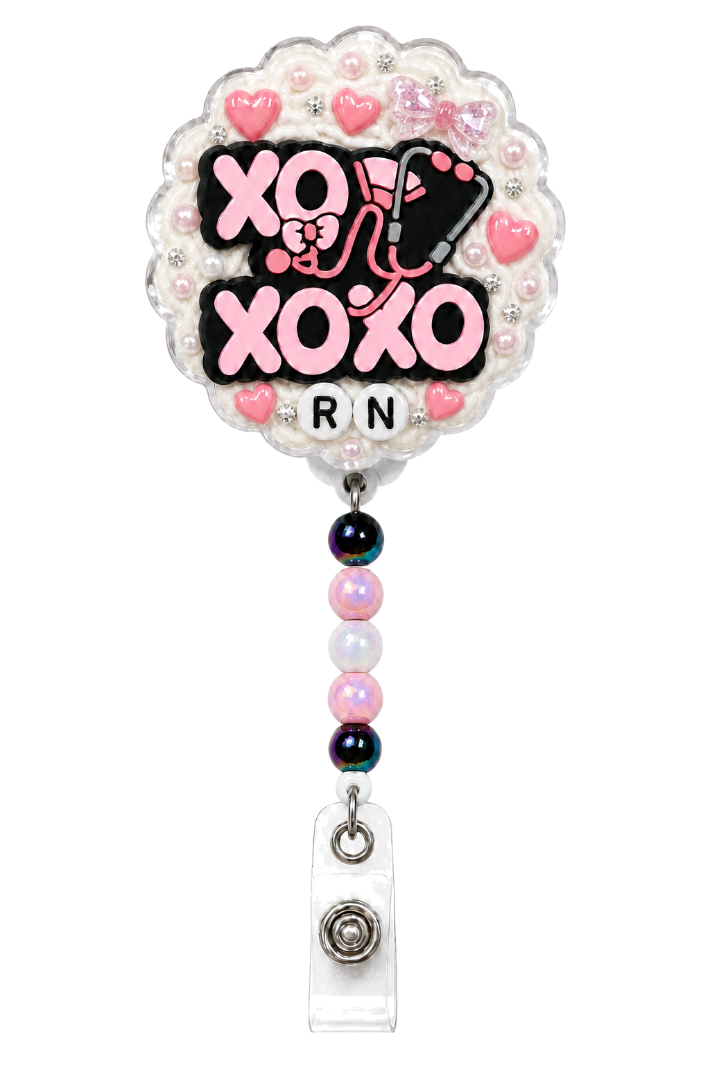 XOXO Nurse RN decoden cream badge reel on a pure white background with stethoscope charm, pink hearts, bow, pearls and pastel beads